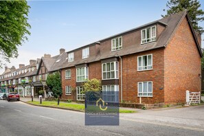 A row of terraced houses with a sign for Lockwell Living.