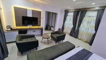 Deluxe Apartment, Balcony, City View | Desk, laptop workspace, blackout drapes, soundproofing