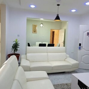 Deluxe Apartment, Balcony, City View | Living area - Kpees Apartment (Abuja)