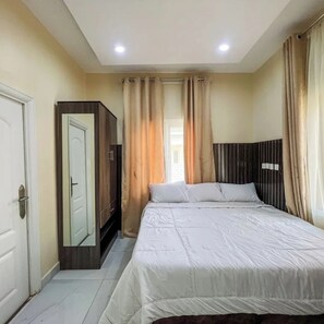 Deluxe Apartment, Balcony, City View | In-room safe, desk, laptop workspace, blackout drapes - Kpees Apartment (Abuja)