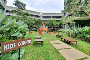 A courtyard with a play area, benches, and a sign labeled 'KIDS CORNER'. - Ipoh All Suite Resort, Jalan Haven Ipoh (Kinta)