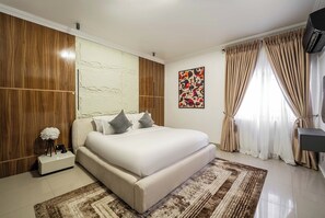 Deluxe Apartment, Balcony, City View | Desk, laptop workspace, blackout drapes, soundproofing