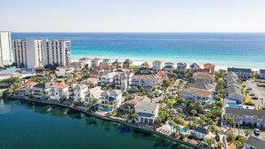 A coastal residential area with houses, a marina, and a beach. - Luxury Beach House Steps to Beach (Destin)