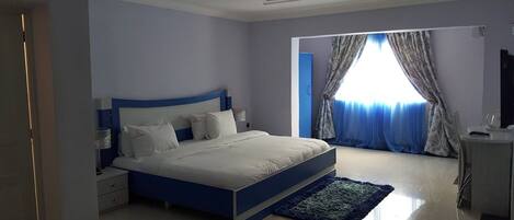 Deluxe Apartment, Balcony, City View | Desk, laptop workspace, blackout curtains, soundproofing