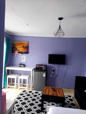 Deluxe Studio | Living area | 24-inch Smart TV with digital channels