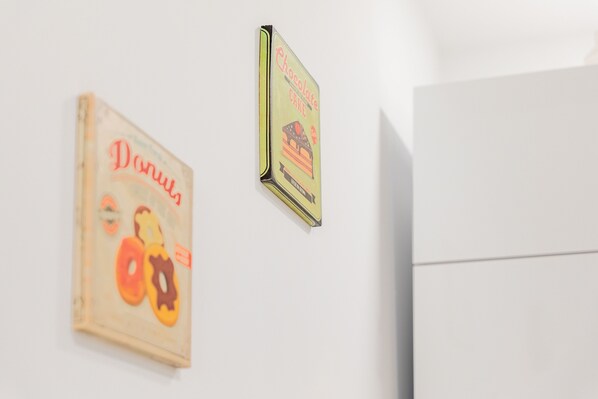 Two vintage posters on a wall.