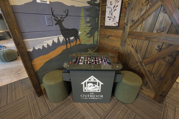 A gaming table with a control panel and a logo that reads 'Overlook at Firesky.'