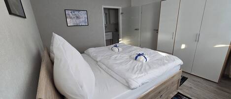 1 bedroom, desk, iron/ironing board, travel crib