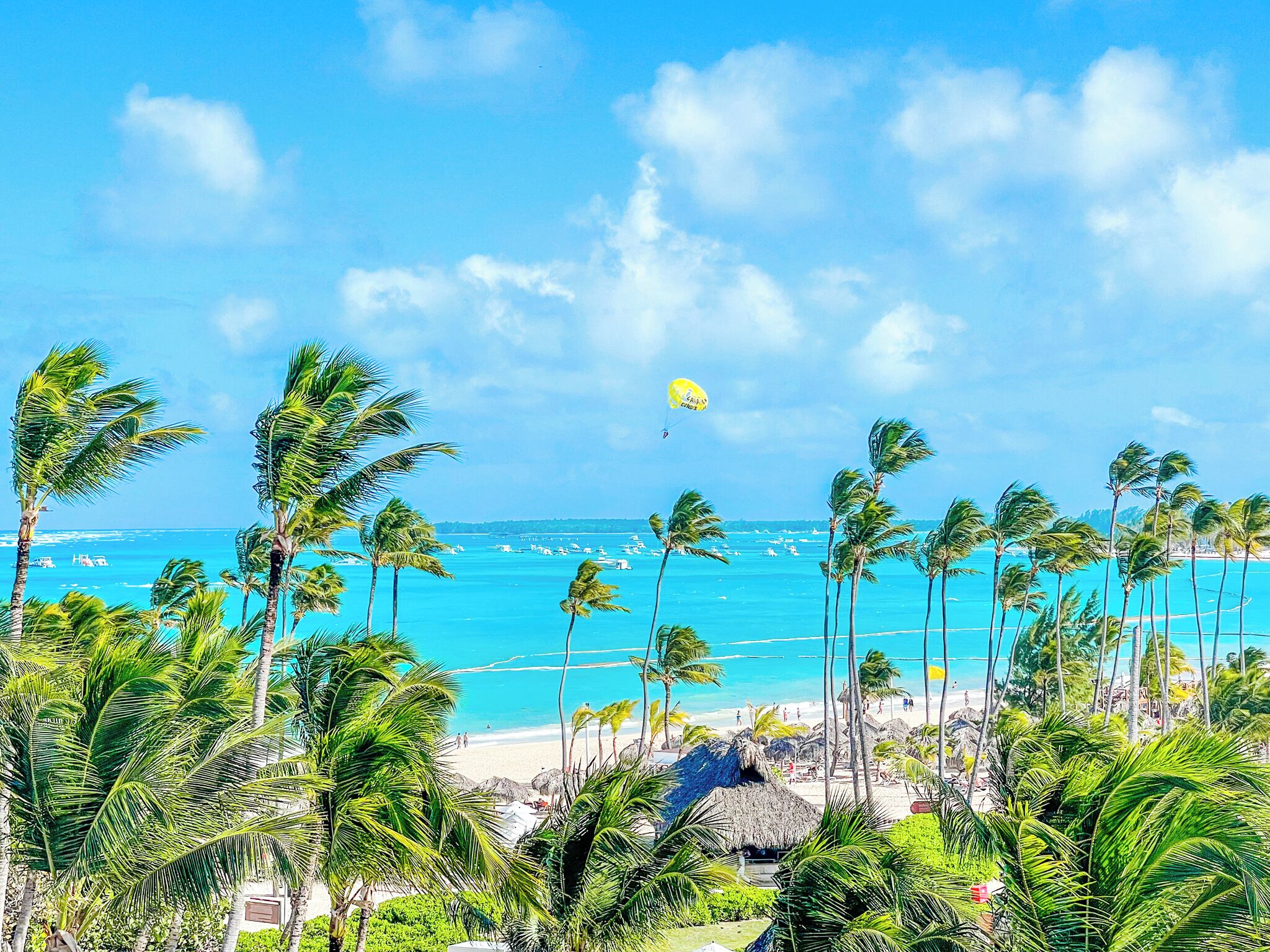 On the beach, white sand, sun loungers, beach umbrellas