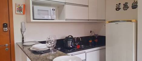 Fridge, microwave, stovetop, coffee/tea maker