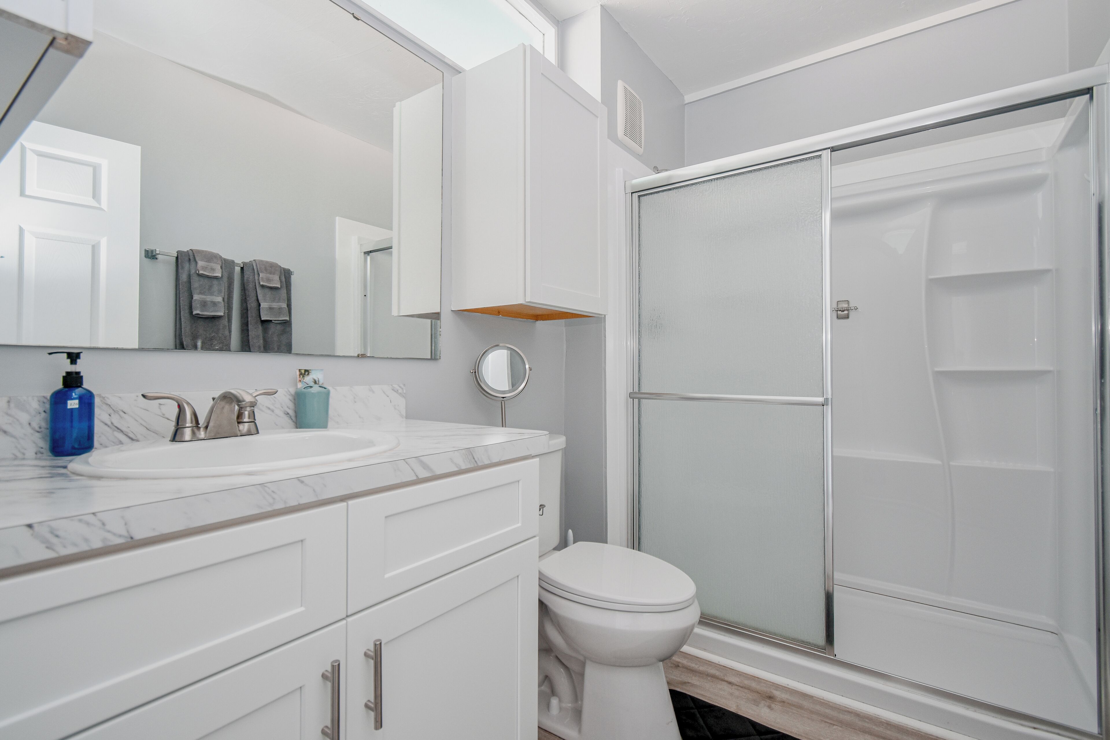 Shower, hair dryer, towels, toilet paper