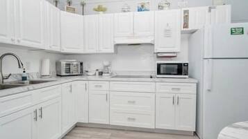 Fridge, microwave, coffee/tea maker, toaster