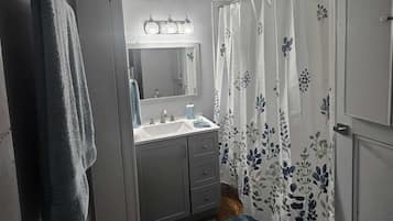 Shower, towels, toilet paper