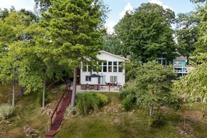 A two-story house with a covered patio and a staircase leading to the upper level. - Waterfront, Views, Pet friendly with fee, Kayaks (Creal Springs)