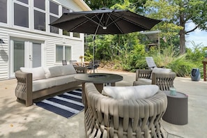 An outdoor seating area with a sofa, chairs, and a round table. - Waterfront, Views, Pet friendly with fee, Kayaks (Creal Springs)