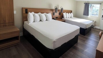 Premium Quadruple Room, 2 Queen Beds, Non Smoking | Desk, laptop workspace, free WiFi, bed sheets