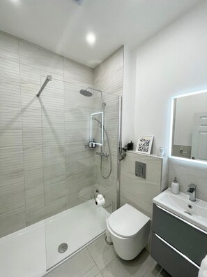 Shower, hair dryer, towels, soap