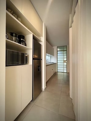Fridge, microwave, stovetop, coffee/tea maker