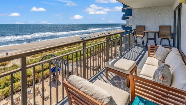 A balcony with a view of the beach and ocean. - Bluewater Resort 406 (Myrtle Beach)