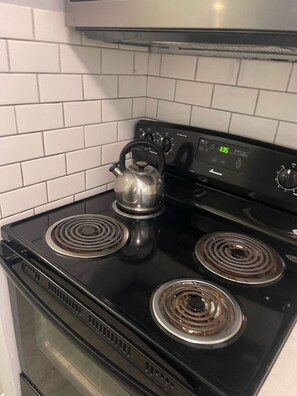 Fridge, microwave, stovetop, coffee/tea maker