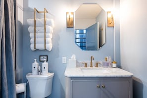 Shower, eco-friendly toiletries, hair dryer, towels
