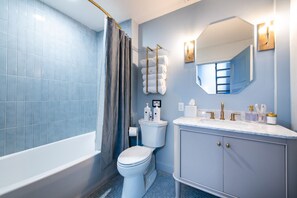 Shower, eco-friendly toiletries, hair dryer, towels