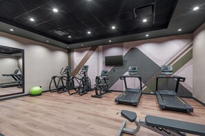 A gym with treadmills, elliptical machines, and a rowing machine. - Drury Inn Pikes Peak Colorado Springs (Colorado Springs)