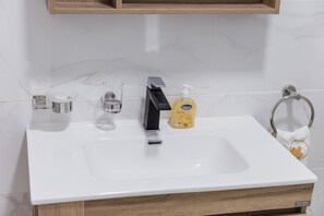 Hair dryer, towels, soap, toilet paper