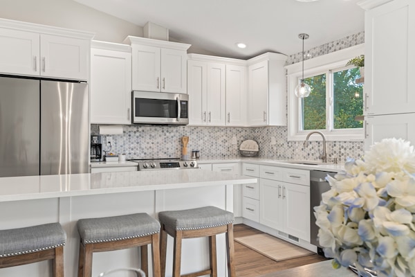 Kitchen is equipped with pots/pans, plates, silverware, serving dishes, glasses