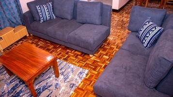 Deluxe Apartment | Living area | 32-inch Smart TV with digital channels