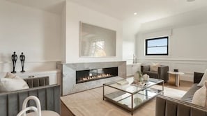 Smart TV, fireplace, books
