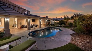A modern house with a swimming pool, outdoor seating, and a patio area. - Luma House | Stylish Getaway w/ Game Room & Pool[Free Early Check-In OR Late Checkout] (Indio)