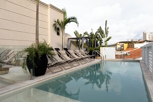 Outdoor pool, open 8:00 AM to 8:00 PM, sun loungers