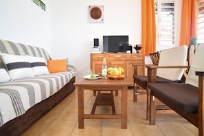 Apartamento, vista para o mar | Área de estar