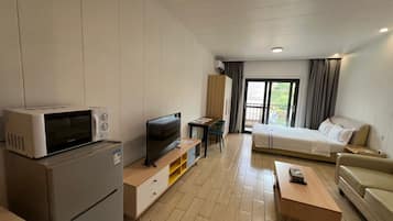 Deluxe Studio, 1 Bedroom, Balcony, Pool View | Desk, blackout curtains, soundproofing, iron/ironing board
