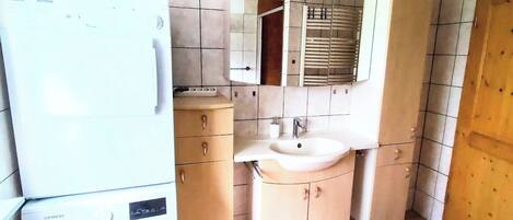 Shower, hair dryer, towels, toilet paper