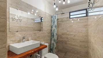 Bungalow, Multiple Beds, Oceanfront | Bathroom | Shower, towels, soap, shampoo