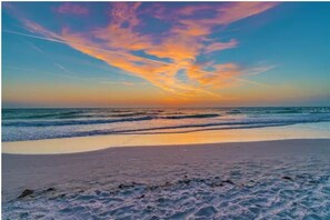 On the beach, sun loungers, beach towels