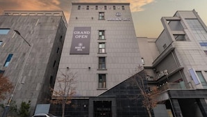 A modern hotel building with a prominent sign stating "GRAND OPEN" and "BROWN-DOWN" on the facade. - Incheon BrownDot Hotel Guwol (Incheon)