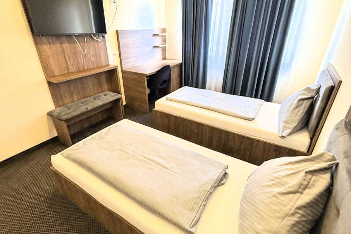 Deluxe Twin Room, Courtyard View | Desk, laptop workspace, free WiFi