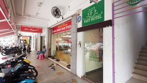 A hotel entrance with a sign for 'FAST HOTEL' and a visible phone number. - Fast Hotel Sri Gombak By Zuzu (Batu Caves)