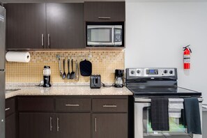 Oven, coffee/tea maker, toaster, cookware/dishes/utensils