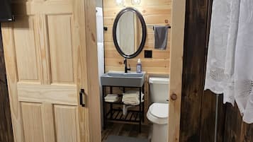 Shower, towels, soap, toilet paper