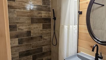 Shower, towels, soap, toilet paper