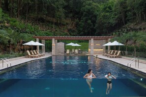Outdoor pool, open 8:30 AM to 8:00 PM, pool loungers