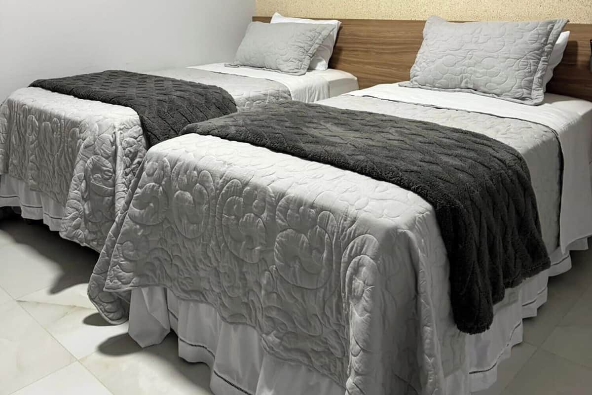 Standard Twin Room, Multiple Bedrooms | Select Comfort beds, laptop workspace, free WiFi