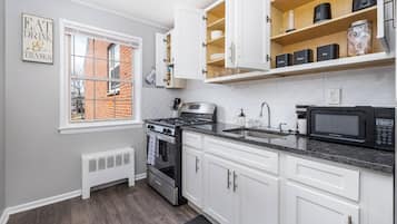 Fridge, microwave, stovetop, coffee/tea maker