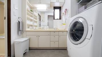 Hair dryer, towels, soap, shampoo