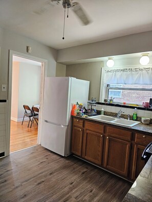 Fridge, microwave, stovetop, cookware/dishes/utensils