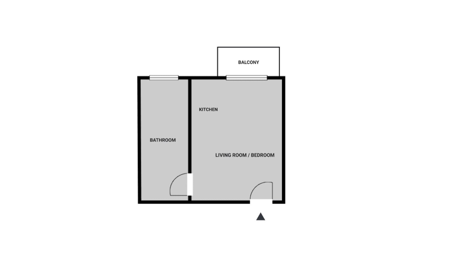 Ein Grundriss mit Küche, Bad, Wohn-/Schlafraum und Balkon.